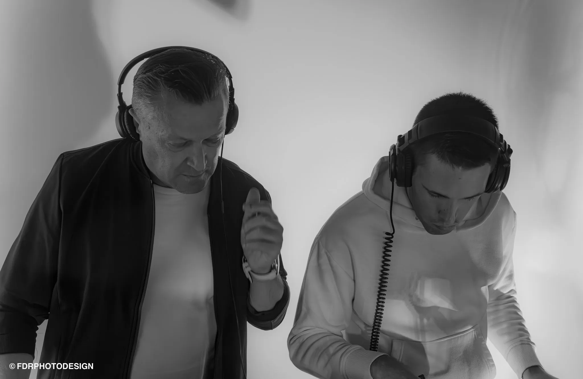 Miky & Sebasto V behind the decks with headphones